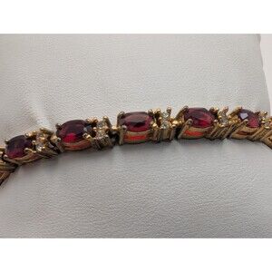 Vintage Avon Gold Tone Ruby Red Rhinestone Crystal Classic Tennis Bracelet 7.5"